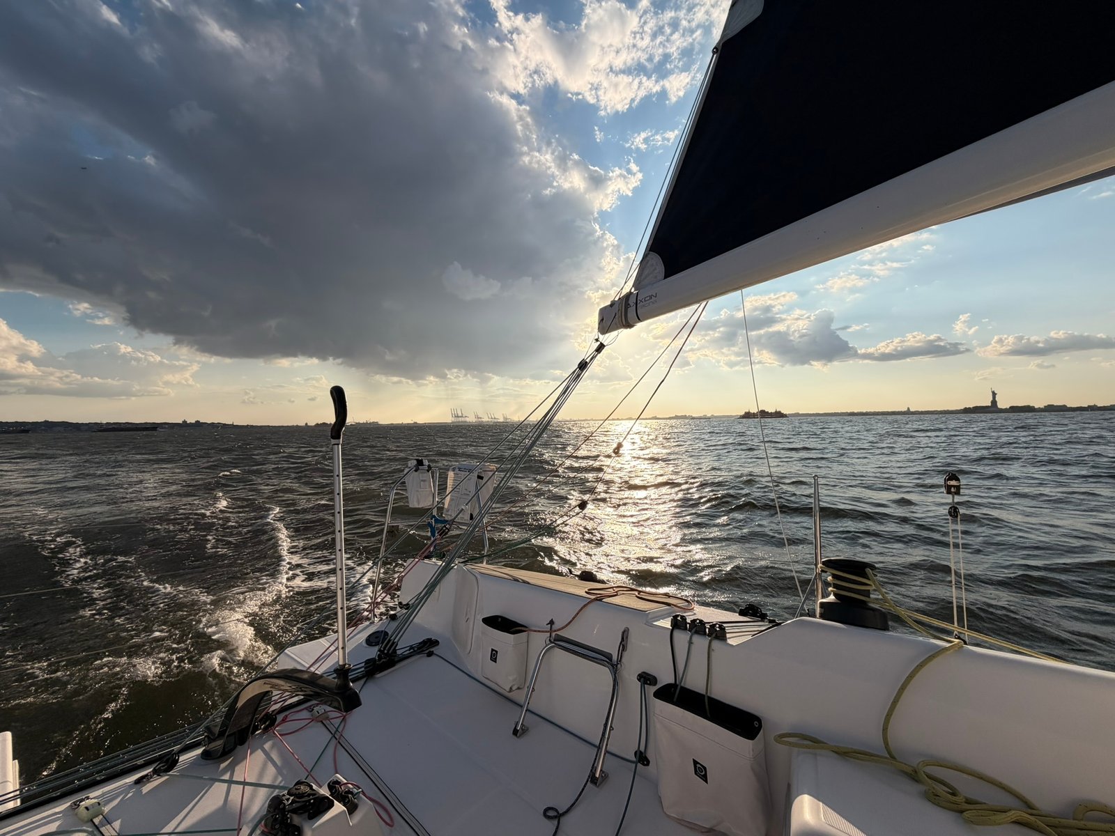 Storm clouds building over the bay — Statue of Liberty in the distance