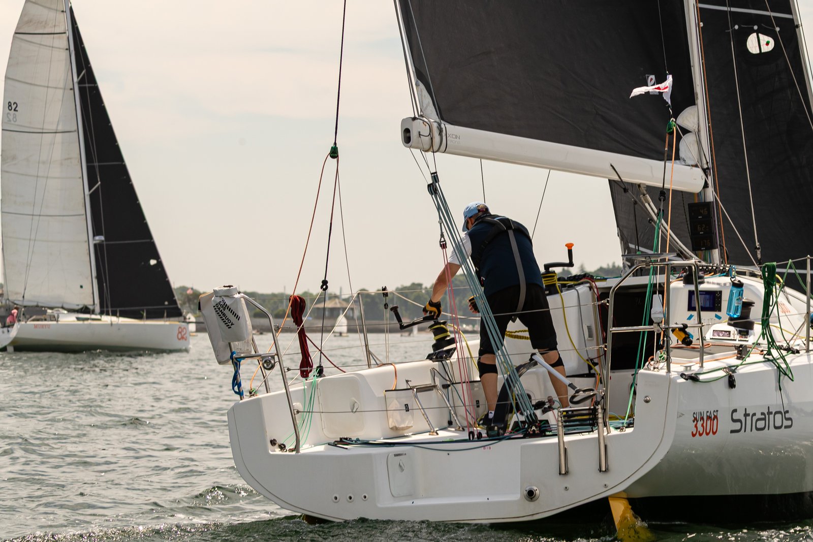 Final prep on the stern — fleet stacking up behind